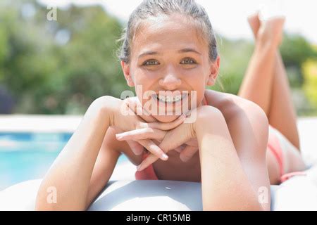 Teenage Girl In A Bikini Sunbathing On The Beach Stock Photo