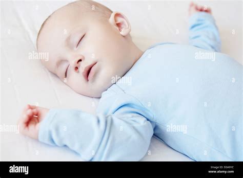 Baby Boy Sleeping In Crib Stock Photo Alamy
