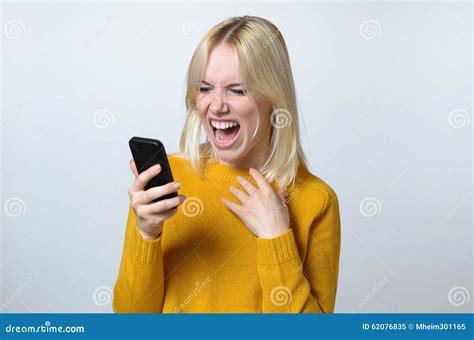 Shocked Young Woman Looking At Her Mobile Phone Stock Image Image Of