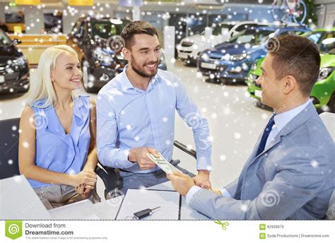 Check spelling or type a new query. Happy Couple With Money Buying Car From Dealer Stock Image - Image of person, dollar: 62928979