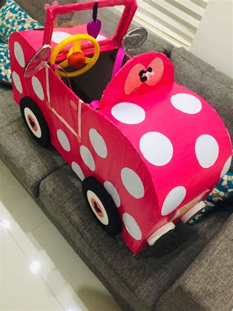 A Pink Car With White Polka Dots On It