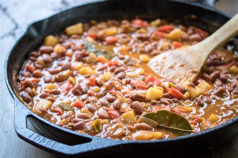 My husband's favorite meal is rice and beans. Saucy Puerto Rican Beans and Potatoes - The Wanderlust Kitchen