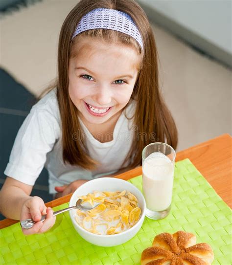 Little Girl Eating Her Breakfast Stock Image Image Of Interior Home