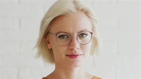Beautiful Young Female With Short Blond Hair Wearing Glasses And