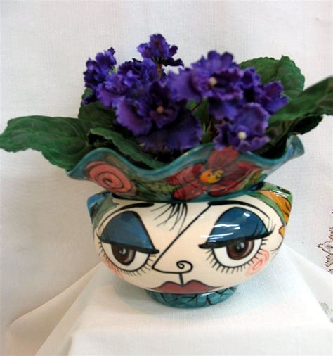 Whimsical Impressionistic Style Face And Assorted Flowers Ceramic