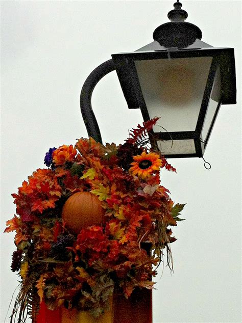 Over the past number of years, they have tried to do something a little different than the usual advent wreath. fall lamp post | Fall wreath, Lamp post, Wreaths