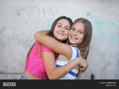 Two Girls Hug Each Image And Photo Free Trial Bigstock