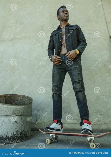 Young Attractive And Serious Black African American Man Riding Skate