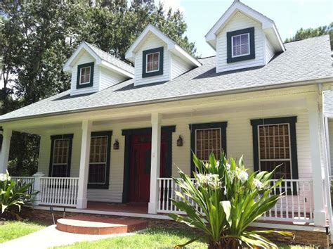A white brick house with unique and prominent black top trim for the windows. black trim around windows | Exterior | Pinterest | Black ...