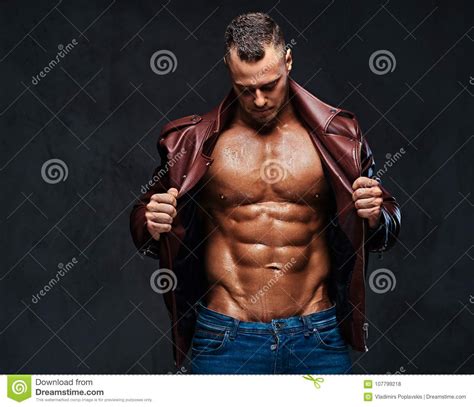 Muscular Male Dressed In A Jacket And Jeans Stock Photo Image Of Handsome Hunk