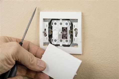 White Electric Switch With On A Wall And Without Cover Stock Photo