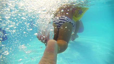 Underwater Shot Of Baby Girl Swimming In The Pool Stock Video Footage