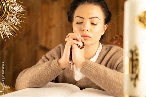 Christian Woman With Bible Praying In Church By The Altar Woman
