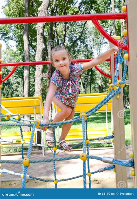 Smiling Little Girl Playing On Playground Equipment Stock Image Image