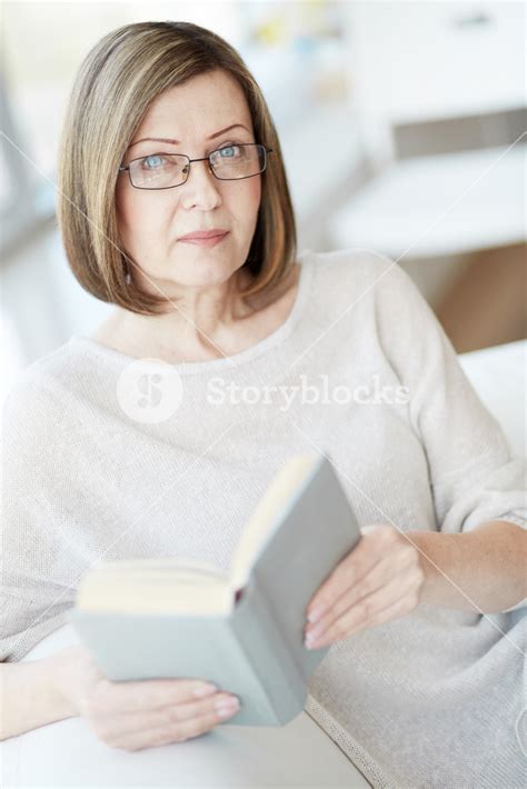 Portrait Of Woman Wearing Eyeglasses With A Book Royalty Free Stock Image Storyblocks
