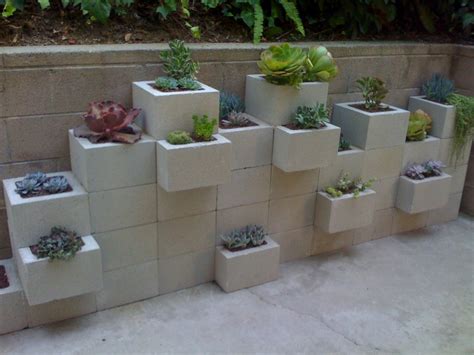 With most of these cinder block using ideas, you won't need much in the way of fancy tools and expensive devices. Cinder Block Garden: Potted's cinder block planter wall
