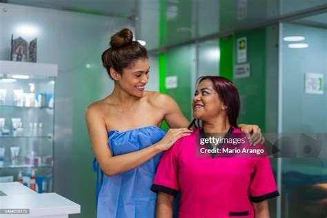 Latina Woman Is In The Middle Of A Beauty Spa Where They Perform Slimming Massages Hugging Her