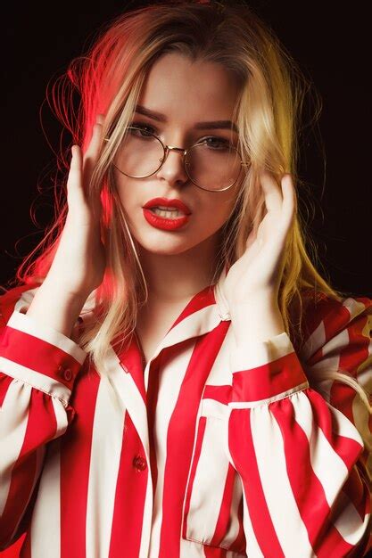 Premium Photo Fashionable Blonde Girl In Glasses Wearing Striped Blouse