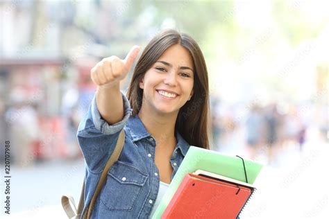 Happy Student Posing With Thumbs Up In The Street Stock Photo Adobe Stock