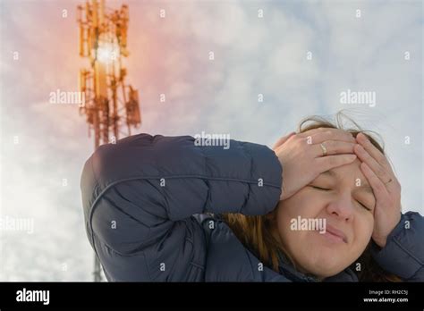 The Woman Is Holding Her Head Near The Bts Harmful Radiation From Cellular Network Transmitters