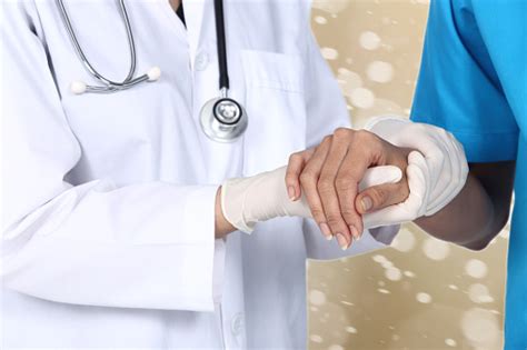 Doctor Holds Patient Hand With Warm Take Care Medical Office Stock