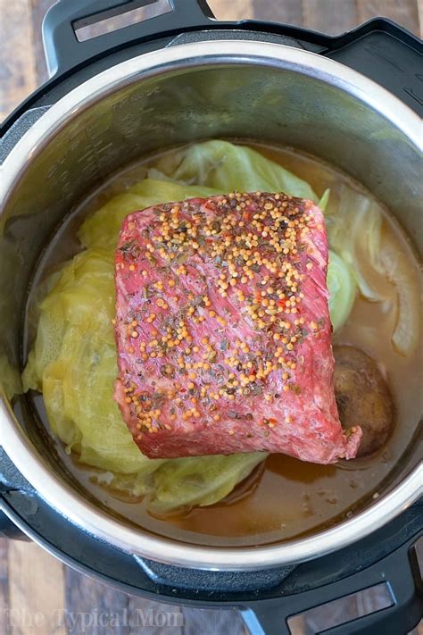 Place corned beef in instant pot, fatty side down and add beef broth and crushed garlic. Easy Instant Pot Corned Beef and Cabbage Recipe + Video