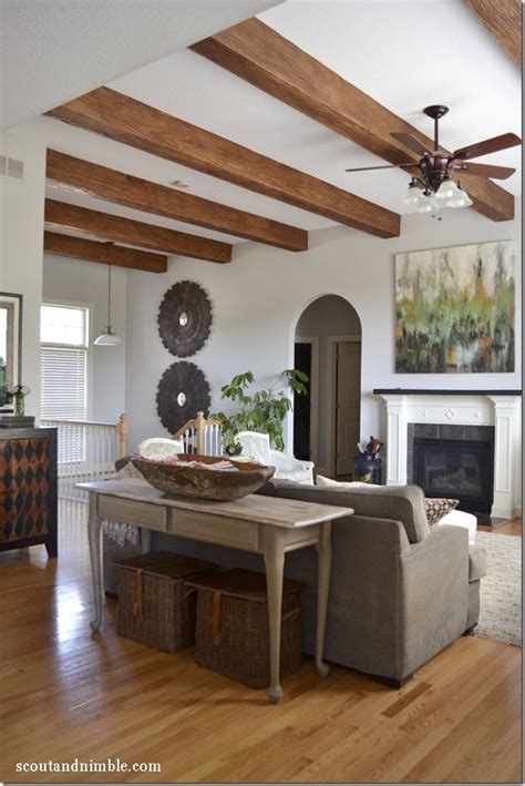 A new fan, or a fan with a light, will help cool your house, add a personal. Feature Friday: Scout and Nimble | Lighting | Faux wood beams, Living room designs, Wood beams