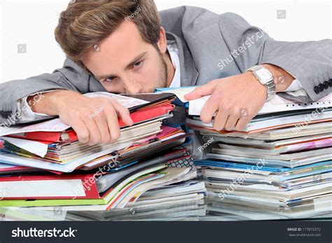 When it comes to paperwork, people think they need to keep everything, said tracie fobes, owner of the personal finance blog penny pinchin mom. Man Drowning Stacks Paperwork Stock Photo 117010372 ...