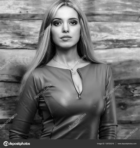 Young Sensual And Beauty Blonde Woman Pose On Wooden Background Black