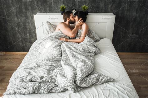 Couple In Love Kissing In Bed Containing Bed Two And Attractive Couple Kiss In Bed Couples
