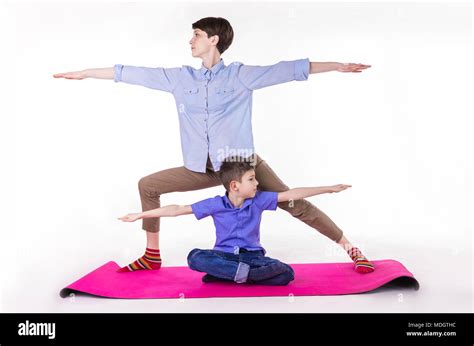 Mother And Son Doing Yoga Spending A Good Time Together Isolated On White Stock Photo Alamy