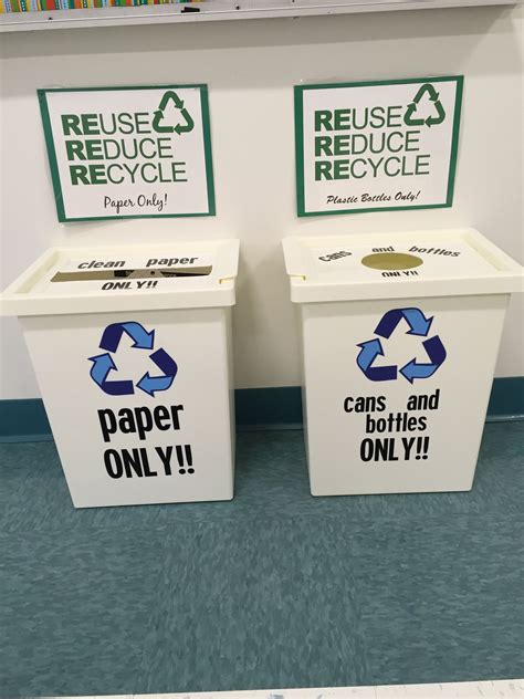 Two Recycling Bins With Reuse Reduce Stickers On Them