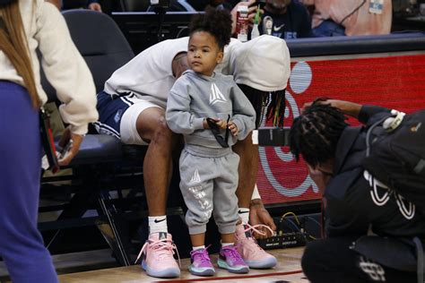 Memphis Grizzlies Guard Ja Morant Ties His Shoes With His Daughter