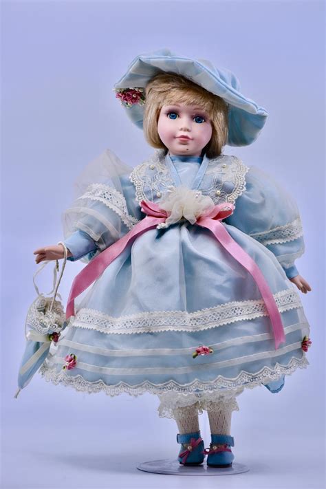 collector porcelain doll blonde hair blue eyes pale bl