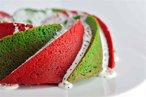 A rich chocolate bundt cake with just the right hint of orange, it's a delicious holiday treat whether you serve it plain or with a dusting of powdered sugar. Christmas Bundt Cake | A Festive Red and Green Holiday Cake!