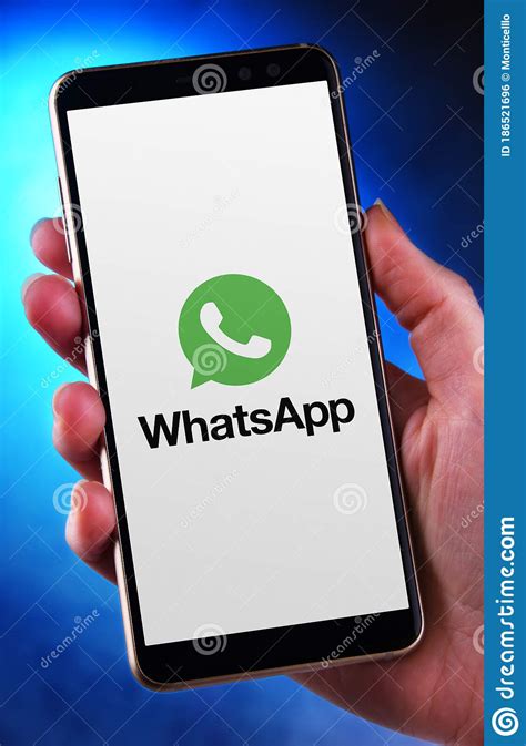 Hand Holding Smartphone Displaying Logo Of Whatsapp Messenger Editorial