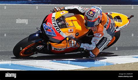 Casey Stoner Of Australia Leans Through A Turn During The Red Bull U