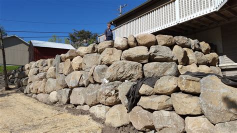 How to install natural stone retaining wall. Block, natural stone or boulder wall retaining walls | NS Landscapes