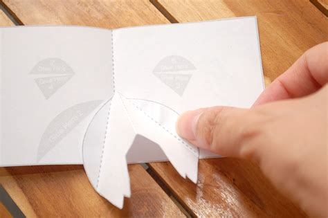 Collect items like card stock, construction paper, scissors, crayons, envelope, and white glue to accomplish this. How to Make a Pig Pop up Card (Robert Sabuda Method)