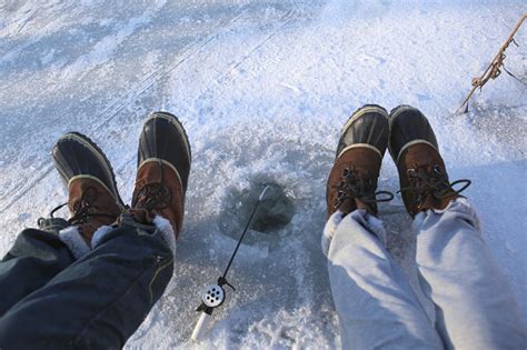Ice Fishing On Frozen Lake Stock Photo Download Image Now Istock