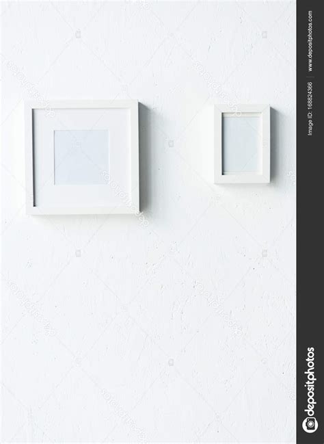 Empty Photo Frames Hanging On Wall — Stock Photo © Vadimvasenin 168824366