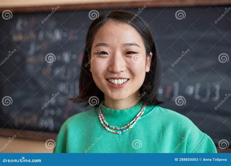 Face Of Happy Young Asian Teacher Or Student In Green Pullover Stock