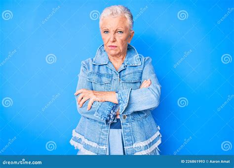 Senior Beautiful Woman With Blue Eyes And Grey Hair Wearing Casual