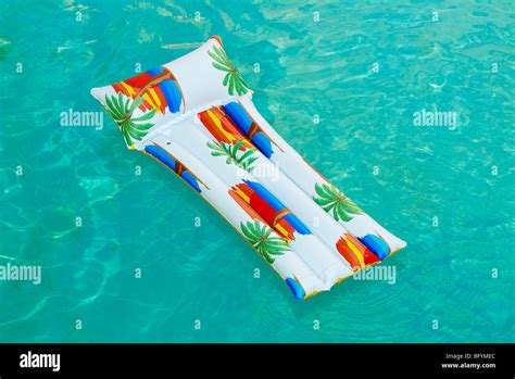 Air Bed Floating In Swimming Pool Stock Photo Alamy
