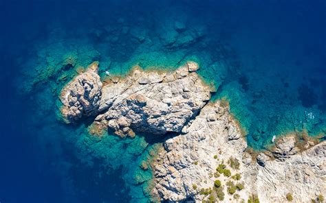 Download Wallpaper 3840x2400 Rocks Island Sea Water Aerial View 4k