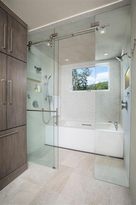 Shower heads, hand showers, rain heads, body sprays, slide bars, shower control valves are all available here or assembled in ideal shower system kits. Tub and Shower Area in Contemporary Bathroom | Bathroom ...