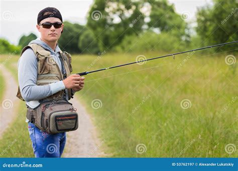 Fisherman On The River Bank Stock Image Image Of Hobby Blue 53762197