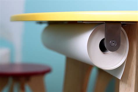 Roll Of Paper Mounted Under A Table For Endless Artistic Possibilities