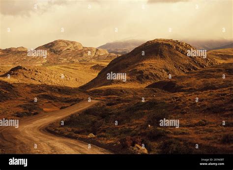 Dirt Road Through A Landscape Stock Photo Alamy