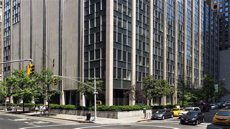 New york state office of the comptroller: 63 Madison building facade at corner of intersection